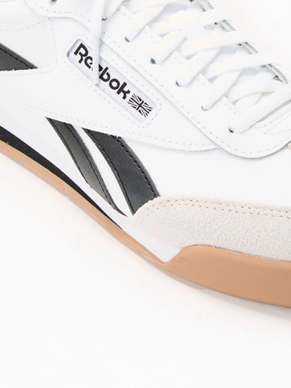 Reebok White Low-Top Sneakers with Black Stripes and Gum Sole Accent
